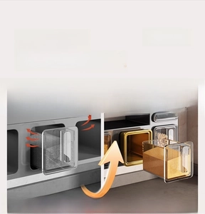Detail showing side-by-side comparison of standard and upgraded sealed kitchen spice boxes