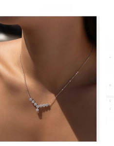 Close-up of S925 silver Y-shaped necklace with sparkling floral diamond pendants