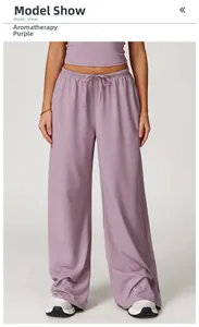 Detail of high-waisted yoga set in lavender featuring drawstring waist and wide-leg trousers