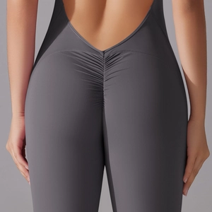 Detailed back view of scrunch butt yoga jumpsuit with high-elasticity dark grey fabric