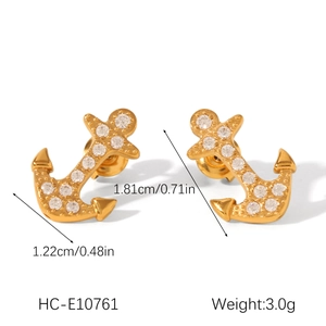 Detailed view of 18K gold-plated anchor earrings with crystal stones and size dimensions