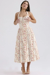 Detail of floral print summer midi dress with pink roses and elegant pleated skirt
