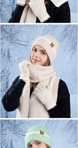 Detailed close-up of winter knitted set featuring vertical stripes and warm fleece texture
