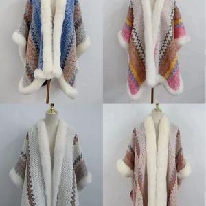Ethnic knit poncho with faux rabbit fur collar and sleeves in four color variants