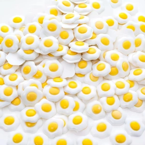 Pile of miniature resin fried eggs decorations for DIY crafts and phone case accessories