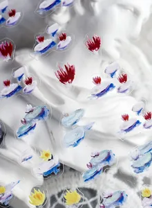 Macro view of matte oil painting style nail stickers with colorful abstract floral patterns