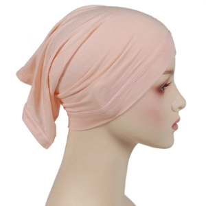 Detail of soft pink modal hijab cap with elastic fabric texture on a model head
