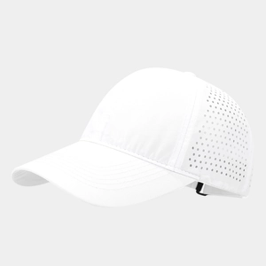 Close-up of laser-perforated breathable holes on a white quick-dry sports baseball cap