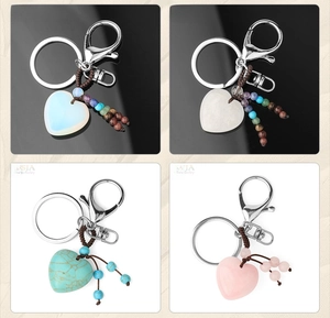 Close-up of heart-shaped natural stone keychains with handmade colorful beaded tassels