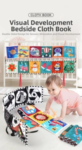 Detail of high-contrast black and white baby cloth book with bed ties for visual stimulation
