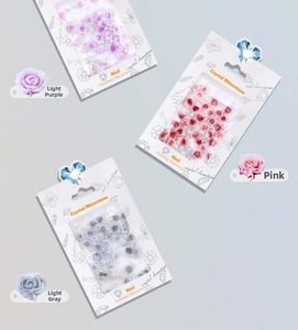 Detailed set of 3D resin roses, pearls, and crystals for nail art in mixed assortments
