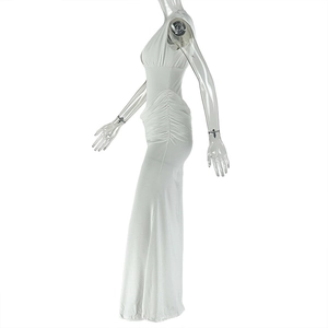 Detailed side view of the white ruched sleeveless dress featuring subtle draped textures