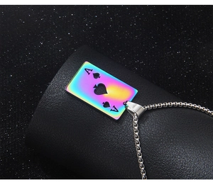 Macro view of rainbow stainless steel Ace of Spades pendant on a silver box chain
