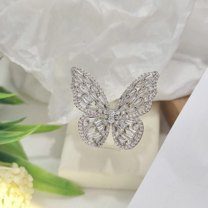 Close-up of a silver butterfly open ring featuring pavé-set clear cubic zirconia crystals