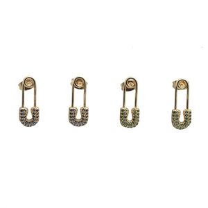 Detail of four gold safety pin earrings with micro-pave blue and green cubic zirconia