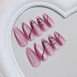 Pink purple cat-eye press on nails with bow design on a heart-shaped mirror base