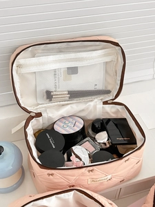Pink quilted makeup bag with bow embroidery and large capacity for travel toiletries