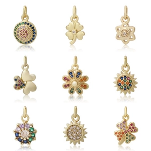 Set of 9 gold-plated micro-pave zircon charms featuring floral and clover shapes