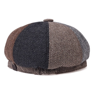 Detailed view of herringbone wool textures and patchwork on this retro newsboy cap
