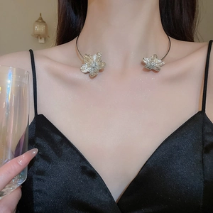 Silver flower choker necklace with double petal pendant on a model's neck detail