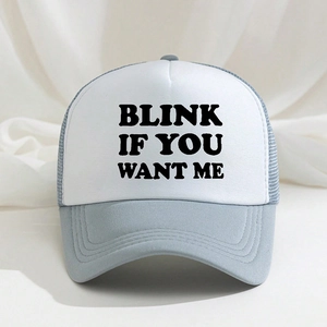 Detail of blue and white trucker hat featuring Blink If You Want Me text with mesh back