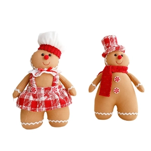 Pair of Christmas gingerbread man plush dolls in warm brown knit with red plaid accents