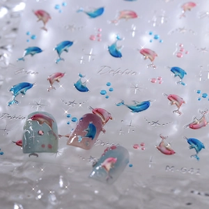 3D embossed dolphin nail stickers with blue-pink gradient ocean patterns and silver foil