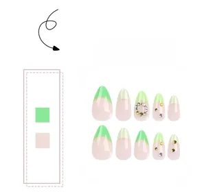 French almond press-on nails in light green and nude pink with rhinestones
