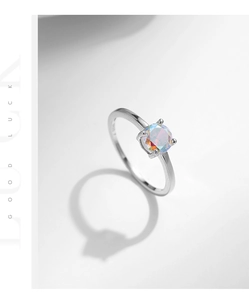 Detail shot of S925 sterling silver ring featuring 4-claw setting and engraved hallmark