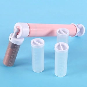 Manual cake airbrush set with pink handheld pump and four scaled clear plastic containers