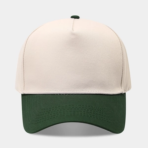 Detail of two-tone baseball cap with beige cotton fabric and dark green brim stitching