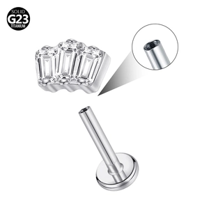 Macro detail of G23 titanium labret stud with internally threaded bar and zircon butterfly