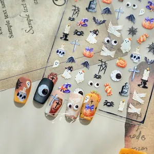 Detail of Halloween nail art stickers with pumpkin and ghost motifs on vintage background