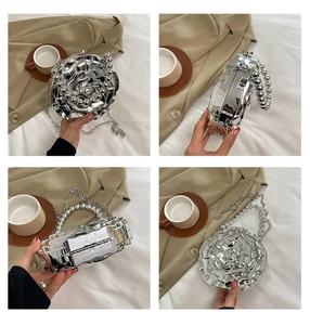 Detailed views of a silver rose-shaped hard shell clutch with elegant pearl handle