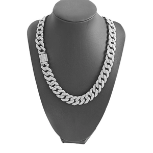 Silver 15mm square clasp Cuban link chain with three rows of diamonds on a black bust