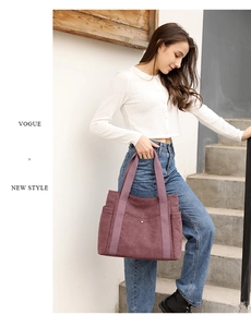 Close-up of mauve canvas tote bag with front snap pocket and durable shoulder straps