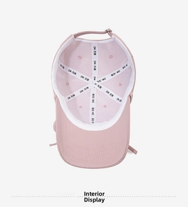 Detail view of pink baseball cap interior showing white seam tape and metal buckle