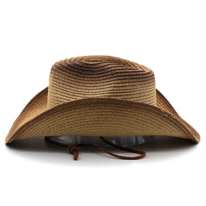 Detail of gradient coffee cowboy straw hat with braided drawstring and curved brim