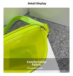 Detail of neon green transparent PVC chest bag with silver zipper and nylon strap