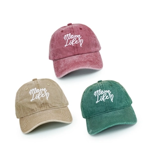 Three washed cotton baseball caps with Mom Life embroidery in pink, khaki and dark green