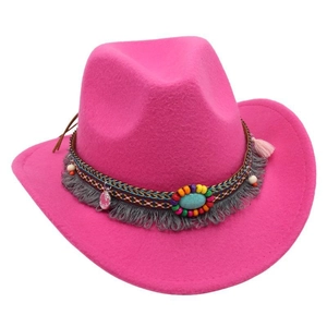 Detail of rose pink felt cowboy hat with boho beaded band, fringe and turquoise stone