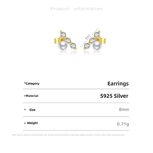 Detail of S925 silver stud earrings with white pearls and sparkling round cut gemstones