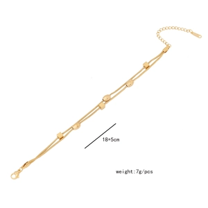 Detailed view of 18+5cm double-layer gold beaded chain bracelet with lobster clasp