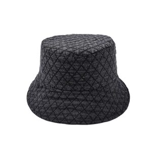 Detailed close-up of dark grey bucket hat with quilted diamond pattern for extra warmth