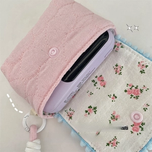 Quilted floral CCD camera bag interior showing storage space for tech and cosmetics