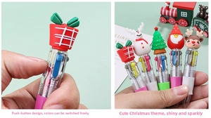Detail of Christmas retractable multi-color pens showing cartoon toppers and clicking mechanism