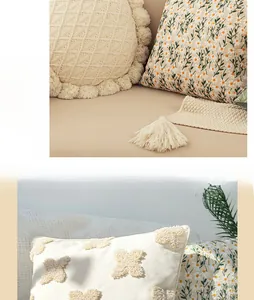 Detailed macro view of embroidered daisy floral patterns and tufted cream pillow covers
