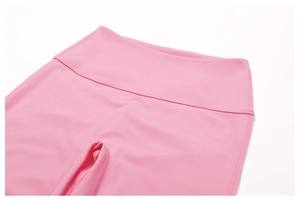 Detail of pink high-waisted yoga leggings showing wide waistband and smooth athletic fabric