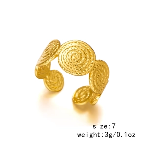 Detail of gold spiral disc rings showing size 7 and weight 3g on white background