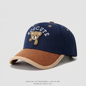 Detail of kids striped corduroy baseball cap with brown bear patch and side view texture